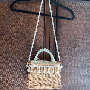 Straw and pearl handbag